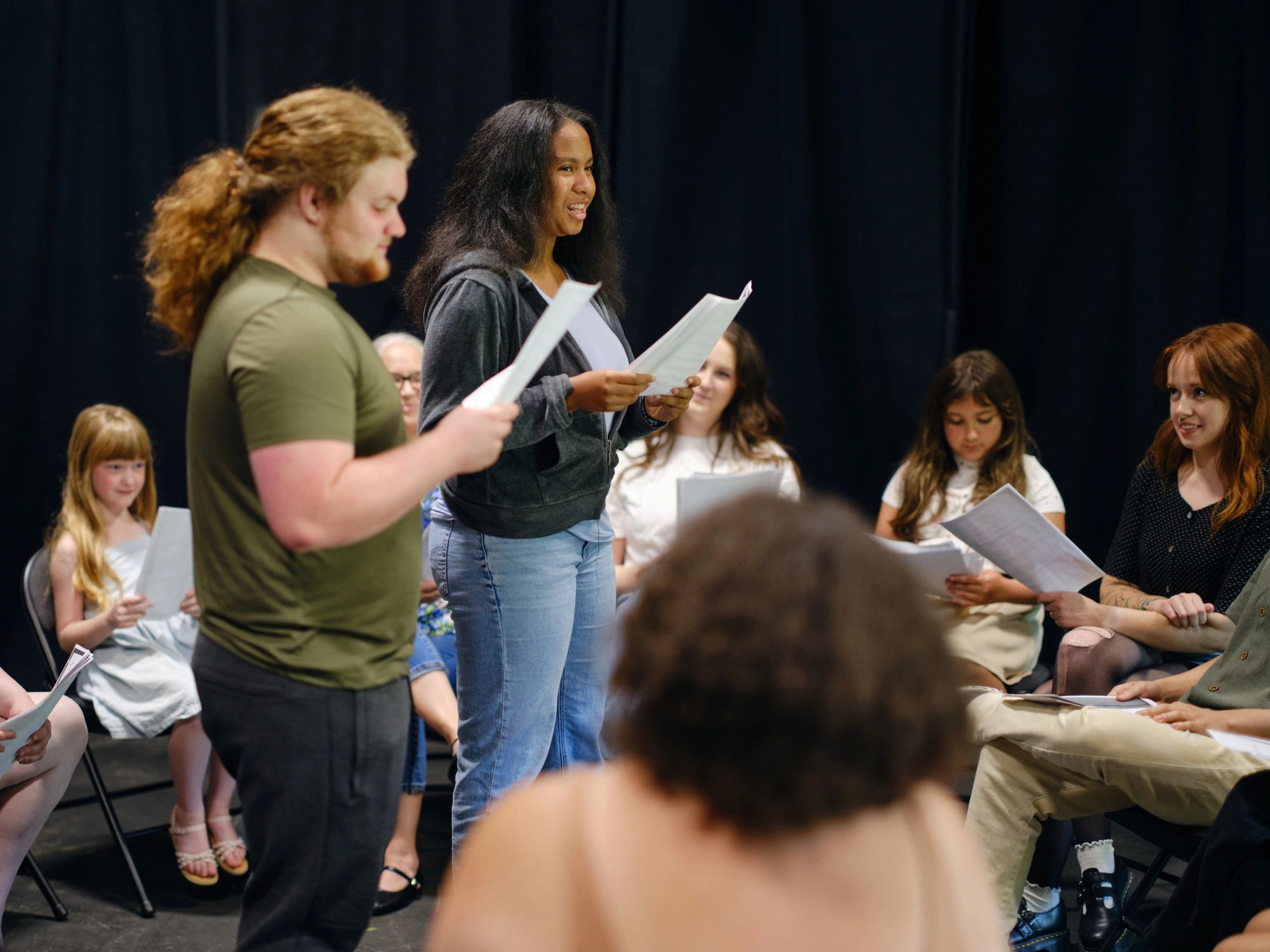 Community theater group rehearsing together